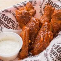 Buffalo Wings · Regular or boneless, served with blue cheese or ranch and celery medium or hot.