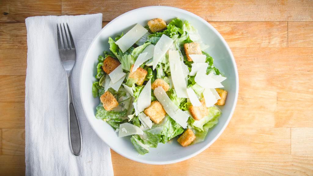 Caesar Salad · Romaine, garlic croutons and Parmesan cheese tossed in caesar dressing.