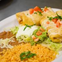 Chimichanga (2) · Choice of ground beef or shredded chicken, covered with cheese sauce. Served with rice, bean...