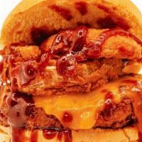 Cheesy Bbq · Filet With Melted Cheddar, Hand-Breaded Onion Rings, and BBQ Sauce