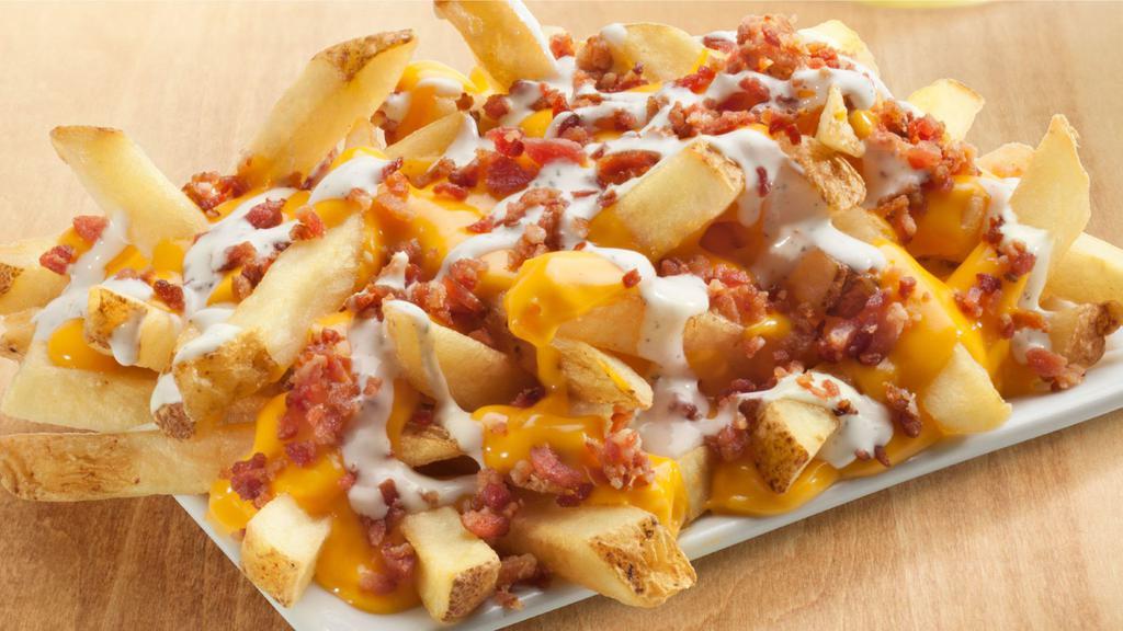 Ultimate Fries · Cheddar cheese sauce, bacon, ranch dressing.