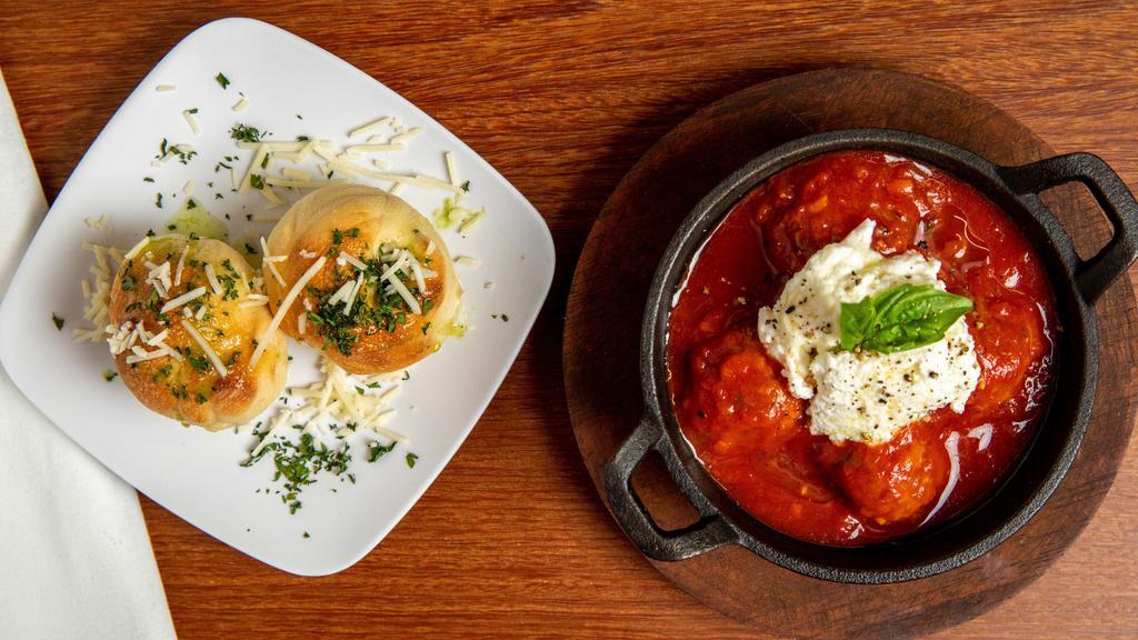 Polpette · Four signature Italian beef meatballs served with ricotta and Parmesan cheese on a tasty homemade pomodoro sauce.