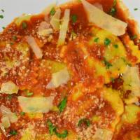 Chicken & Spinaci Ravioli · Artisan chicken and spinach filled ravioli served over our homemade Pomodoro sauce, or alfre...