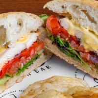 Grilled Chicken Panini · Grilled chicken, roasted peppers, sliced tomatoes, caramelized onions, mixed greens and hone...