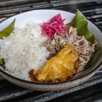 The Luau Pig · Slow roasted pork shoulder on banana leaf with hawaiian salt, coconut rice, and pickled onion.