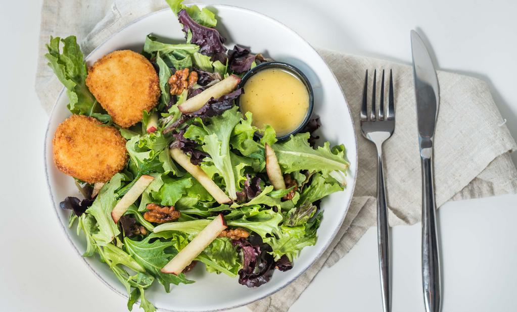 Apple Walnut Salad · Mixed greens, goat cheese croquettes, Granny Smith apples, candied walnuts, and citrus vinaigrette.