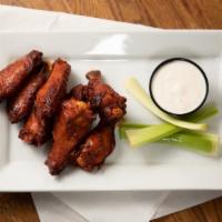Korean Style Wings · Kimchi marinated chicken wings, Asian hot sauce, and celery.