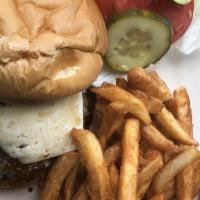 Lamb Burger · Middle eastern spices, goat cheese, housemade bun, and Cajun fries. Comes with lettuce, toma...