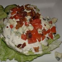 Wedge Salad · Gluten free. Quarter iceberg, homemade ranch, diced tomatoes, applewood smoked bacon, cucumb...