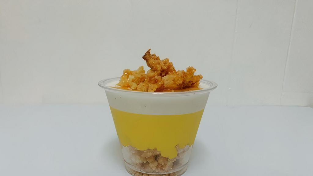 Coconut And Passion Fruit Mousse · layer of freshly grated coconut crumble, coconut & passion fruit mousse in 9oz glass. caramel drizzled.
contain Mango.