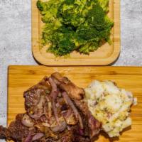 Steak Dinner (Ribeye) · With 2 Sides.