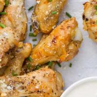 Classic Garlic Parmesan Wings · Six piece chicken wings tossed in garlic Parmesan. served with fries