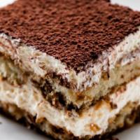 Tiramisu · Mascarpone cheese lady fingers dipped in coffee and coated with cacao powder served with whi...