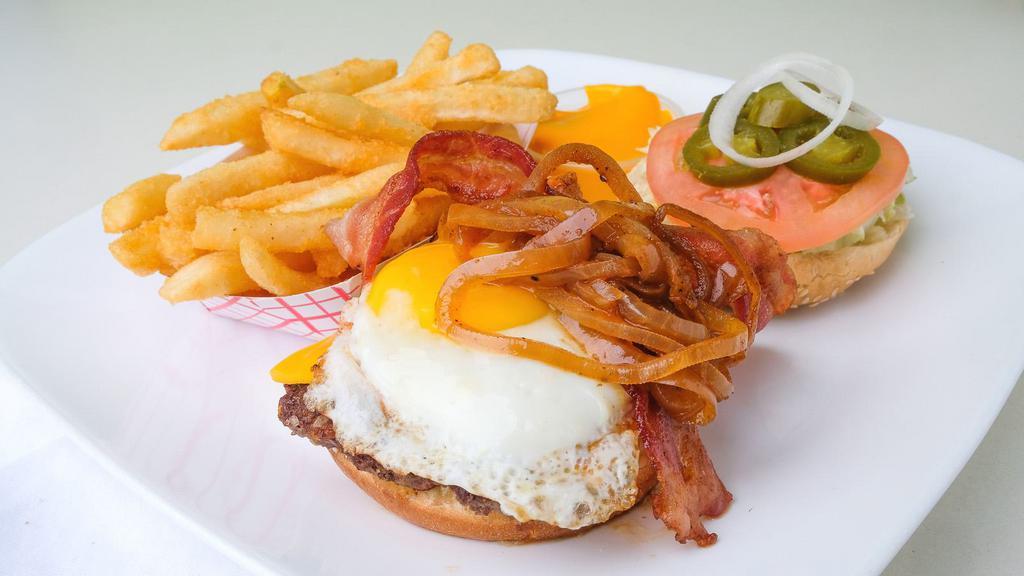 Muncheez (The Hangover) Cheeseburger Deluxe · Most popular. ( 1/2 pound USDA beef patty), Sunny side up egg, bacon, jalapenos, and fries. Served with cheese sauce.