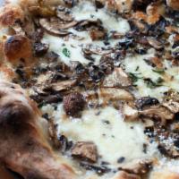 Wild Mushroom Pizza · Local seasonal wild mushrooms, garlic, oregano, Grande provolone and fior di latte fresh moz...