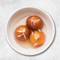 Gulab Jamun · Soft cottage cheese dumplings steeped in rose and cardamom syrup.