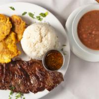 Churrasco Steak · Chef Favorites.Grilled skirt steak served with white rice and two sides with Argentinian chi...