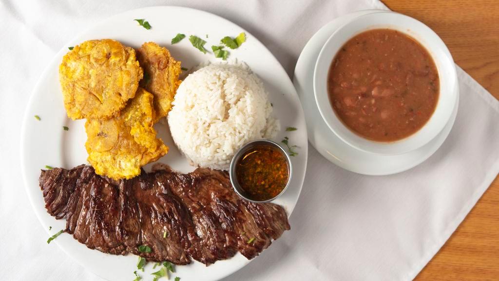 Churrasco Steak · Chef Favorites.Grilled skirt steak served with white rice and two sides with Argentinian chimichurri on the side.