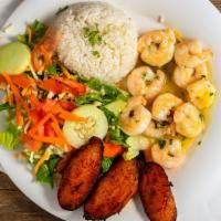 Camarones Sazonados · Shrimp marinated in garlic, butter and spices sauce, served with white rice and two sides.