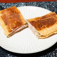 Cuban Toast (Tostada) · Cuban bread dripping with butter and put on the plancha (heat pressed and toasted). So good ...
