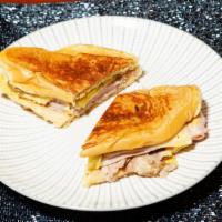 Media Noche (Midnight) Sandwich · Pork, ham, and cheese on a sweet bread.