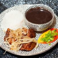 Pork Chunks (Masas De Puerco) · Served with white rice black beans and plantains.