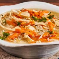 Greek Lemon Chicken Soup · Bowl of our fresh homemade lemon chicken soup served with soft pita