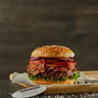Bbq Pulled Pork Burger · Black Angus ground beef burger on a sesame bun topped with lettuce, tomatoes, onions, and BB...