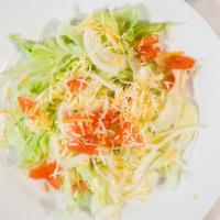 Garden Salad · Romaine and iceberg lettuce, tomatoes, onion, cucumber, carrots, bell pepper and cheese.