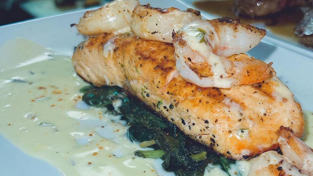 Grilled Mojo Salmon · served with Grilled Shrimp, Sauteed Spinach, Plantain , Rice Pilaf - Beurre Blanc