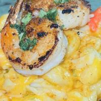 Seafood Mac N Cheeze · contains shellfish, topped with Shrimp
