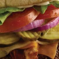The Ultimate Bacon Cheeseburger · Cheddar and pepper jack cheese, 3 strips of bacon, lettuce, tomato, pickles, onion and mayo..