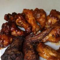 Chicken Wings · Your choice of Chicken wings comes with Fries

-No Flour used

-Fried Crispy 

-Wet wings 

...