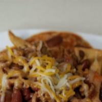 Chili Cheese Fries · Crispy Steak Fries Served with Chili and Queso Cheese .

Topped with Shredded Cheese and Sou...