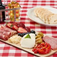 The Bridge Board · Our play on a charcuterie board, featuring a generous assortment of Italian meats, cheeses, ...