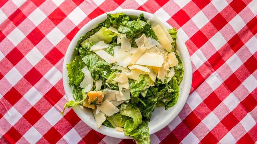 Caesar Salad · Romaine lettuce, shaved Italian cheese, coal oven baked croutons, traditional caesar dressing.