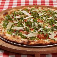 Prosciutto Arugula · Our classic White pizza topped with thinly sliced prosciutto, shaved cheese blend and fresh ...