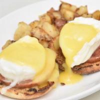 Eggs Benedict · Two poached eggs and Canadian bacon, on top of an English muffin, covered in fresh homemade ...