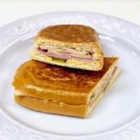 Medianoche Sandwich / Sandwich De Medianoche (8458) · Ham, roast pork, Swiss cheese, pickles & mustard on sweet egg roll. / Jamon ahumado, pierna ...