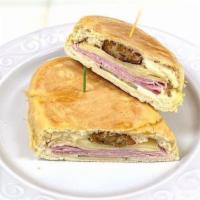 Croquette Special / Croqueta Preparada Sandwich (8478) · Ham and Swiss cheese, croquetas (2), pickles, and mustard on a Cuban bread roll.