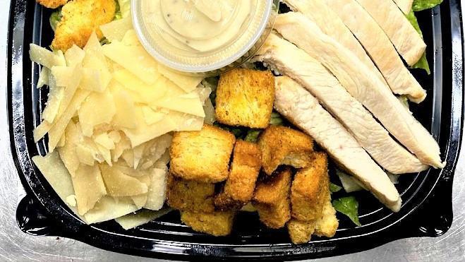 Chicken Caesar Salad / Ensalada Caesar Con Pollo (75152) · Romaine lettuce, chicken breast, croutons, Parmesan cheese & Creamy Caesar dressing. / Lechuga romana, pechuga de pollo, croutons, queso parmesano y aderezo caesar.