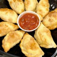 Mini Empanadas Pack · Enjoy this traditional Argentinian favorite just reheat for a few minutes in the oven, air f...