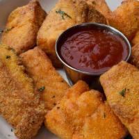 Deep Fried Salmon Nuggets · Deep fried salmon bites topped with our signature mystery sauce