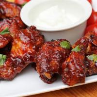 Honey Bbq Wings · Cooked wing of a chicken coated in sauce or seasoning.