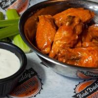 Chicken Wings · Served with blue cheese or ranch dressing & celery sticks. Tossed in your choice of traditio...