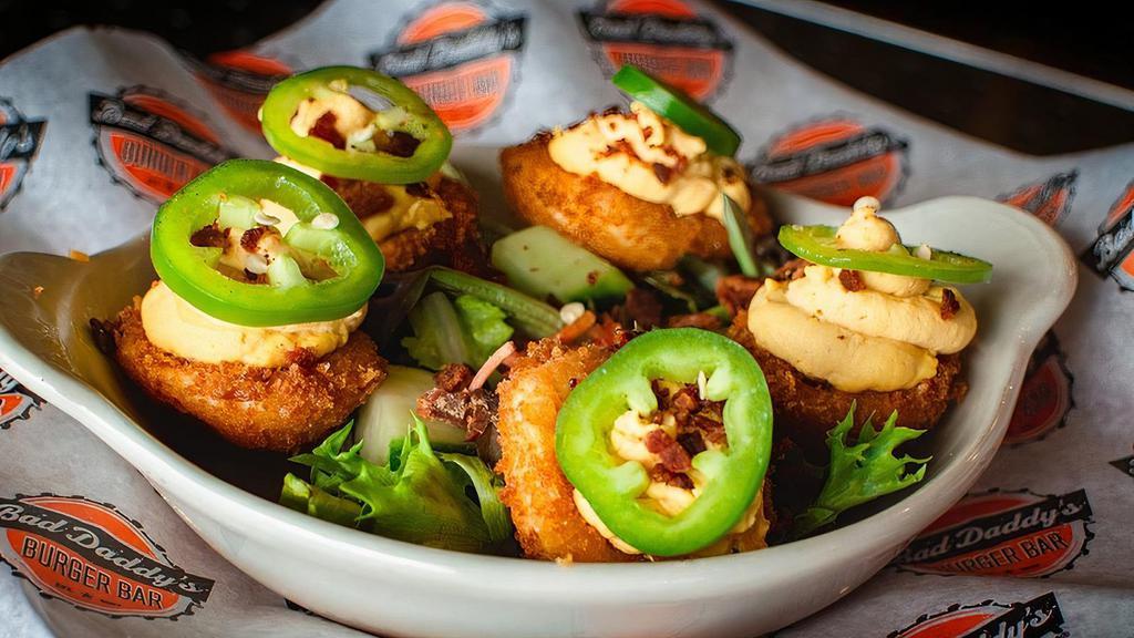 Not Your Mama'S Deviled Eggs · Five lightly fried deviled eggs with a spicy filling, crumbled bacon & garnished with a fresh jalapeno slice.