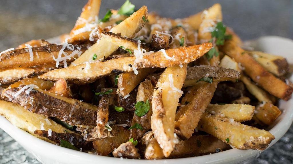 Truffle Parmesan Fries · Hand-Cut fries tossed with truffle salt, Parmesan cheese, green onions, herbs & parsley with creamy truffle aioli on the side