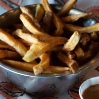 Hand-Cut French Fries · Classic hand-cut fries served with a side of our famous Bad Daddy's sauce