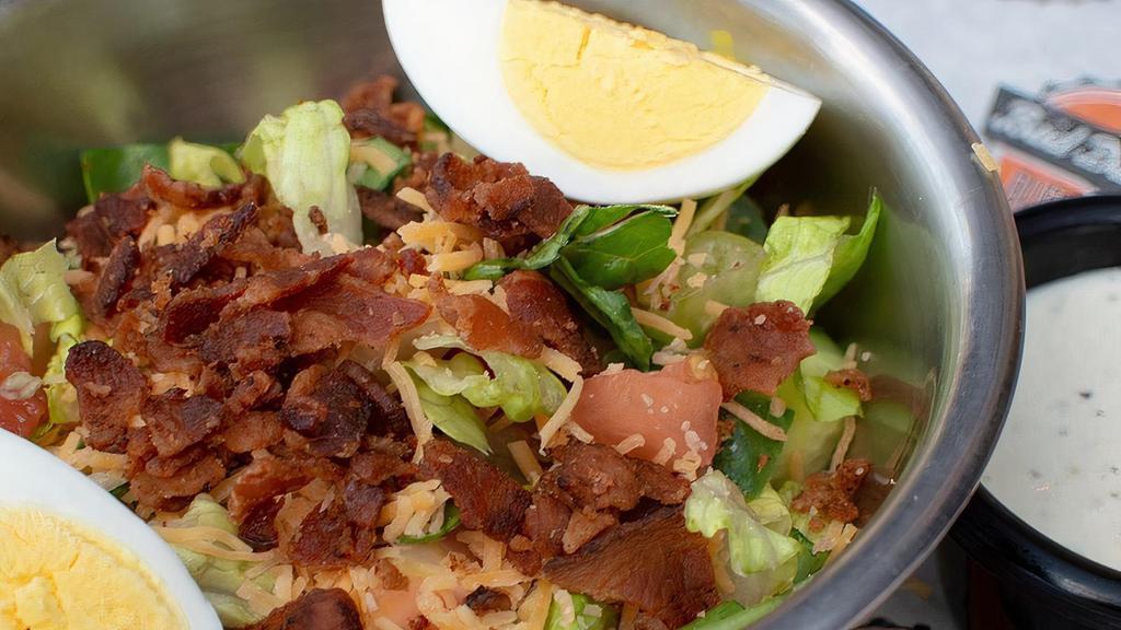 House Side Salad · Salad made with Romaine Lettuce, Cucumbers, Diced Tomatoes, Egg Slice, Cheddar Cheese and Bacon Crumbles and Choice of Salad Dressing