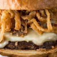 Western Burger* · 100% buffalo burger topped with Monterey Jack, seasoned fried onion straws & barbecue sauce